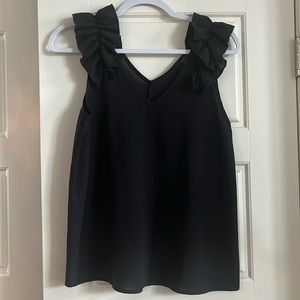 Black blouse with ruffled shoulders